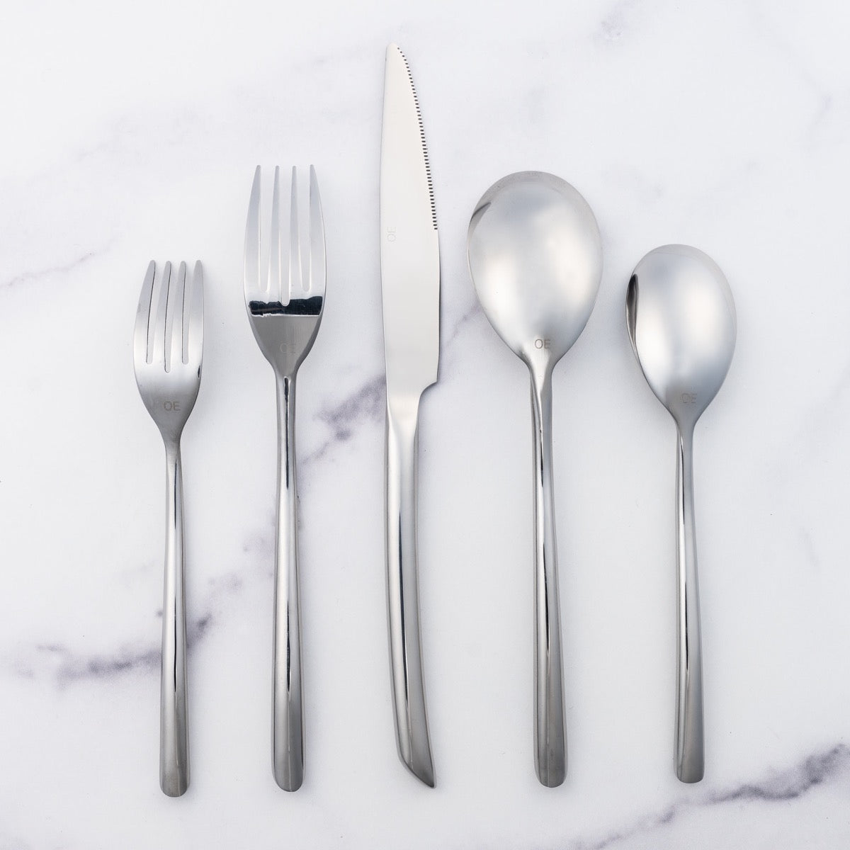 cutlery set elegantly displayed, showcasing their radiant and luxurious finish.