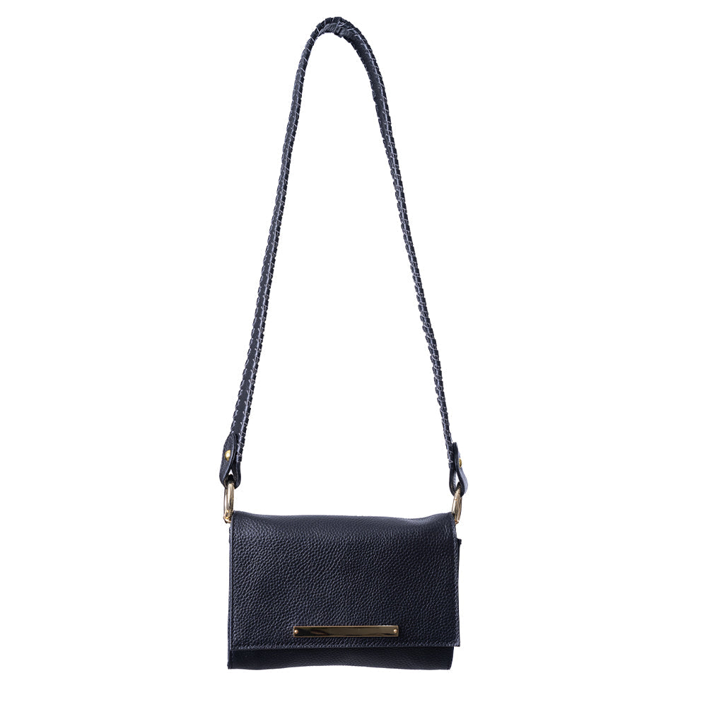 Lelu crossbody bag in rich cognac hue, displayed to emphasize its sleek design and stylish versatility for traveling 