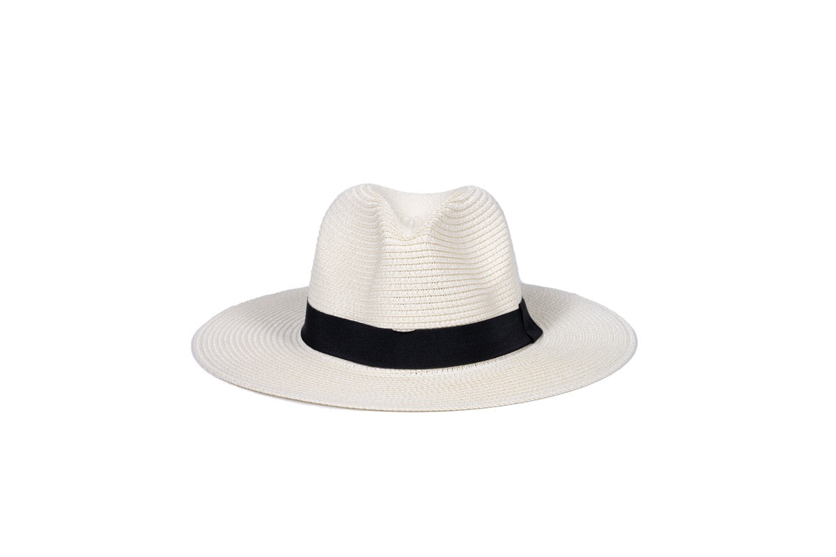 Onna Ehrlich Foldable cream colored hat, laid out to showcase, perfect for stylish sun protection on the go and foldable for traveling 