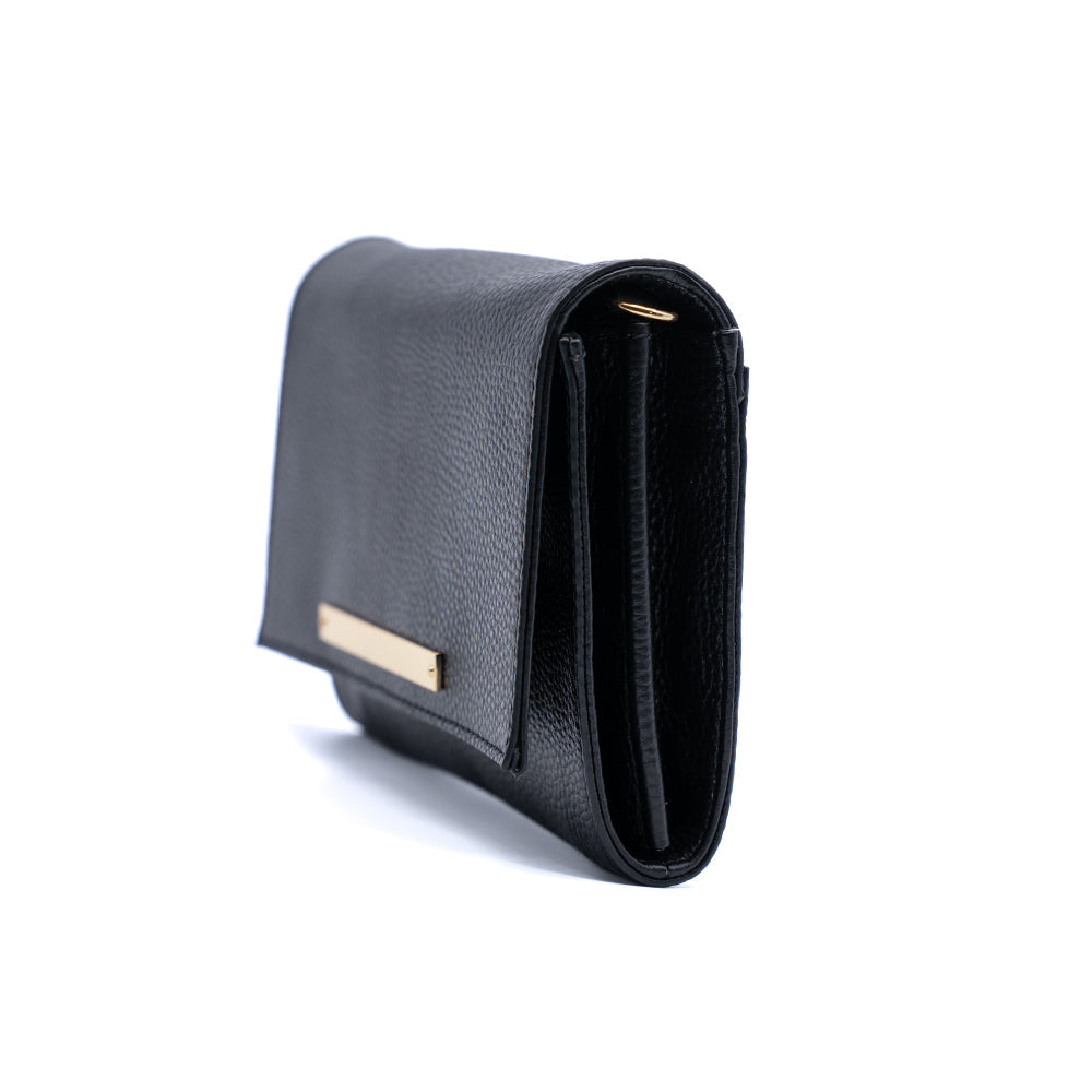 Lelu crossbody bag in rich cognac hue, displayed to emphasize its sleek design and stylish versatility for on-the-go a clutch and crossbody bag